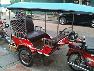 Tuktuk outfitted with anti-bag snatching netting in Phnom Penh, Cambodia. Photo from Casey Nelson