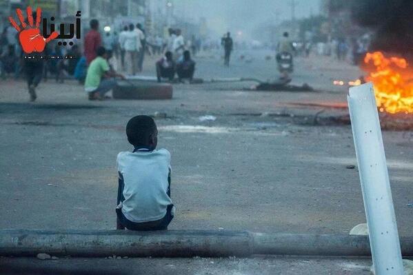 On Twitter, Yasir Yaha shares this photograph of a child watching the mayhem unfold in Sudan. Photo credit: @yasirya7ia