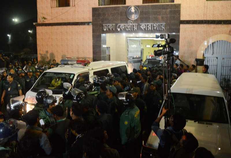 An ambulance carrying the body of Abdul Quader Molla leaves the Dhaka Central Jail after his execution for war crimes. Molla was hanged at 10:01am on Thursday night and the ambulance left at around 11:14pm. Image by Anwar Hossain Joy. Copyright Demotix (12/12/2013)