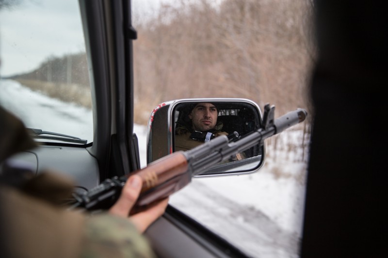 Volnovakha, Ukraine. 28th December 2014 -- A soldier sitting in the SUV during the control area. In a few kilometers are territory controlled by pro-Russian separatists. -- Ukrainian military patrols, and carries out inspections near the border areas that were controlled by terrorists, near the town of Volnovakha, 50 kilometers from Donetsk. Photo by Oleksandr Ratushniak, © Demotix 2014.