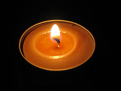 lit votive candle