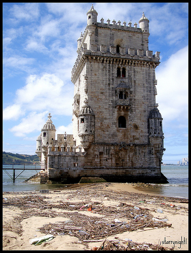 Tower of Belem in Portugal surrounded by garbage. Photo by Flickr user starrynight1.