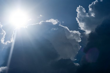 Sun hides behind clouds - by Dan A'Vard