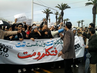 Banner reads: "If you speak, you will die; and if you keep quiet, you will die. So speak up and die!"