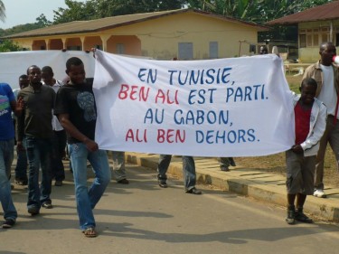 Meyo-Kye, North Gabon, 2 February, 2011. Banner reads: "In Tunisia, Ben Ali left. In Gabon, Ali Ben out."