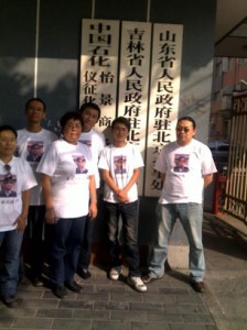 Activists stage a 'free Guangcheng' t-shirt protest.