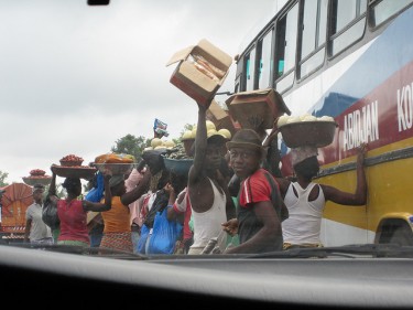 Roadside businesses in Abidjan, Côte d'Ivoire. Image by Flick user CJR836 (Creative Commons License).
