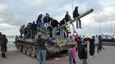 Libya: Kids playing on a tank