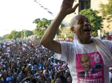 Haitian presidential candidate Michel Martelly in front of thousands of supporters at a rally in capital Port au Prince. Image by Jose Guzman, copyright Demotix (25/11/2010).