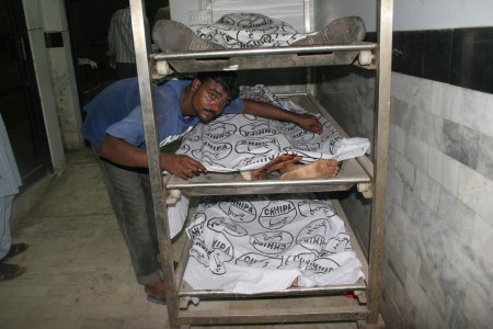 Victims of the explosion at Rummy Club, Karachi are put in a morgue. Image by Syed Yasir Kazmi, copyright Demotix (21/04/2011).