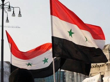 Syrian flags. Image by Flickr user SamueleGhilardi (CC BY-NC-ND 2.0).