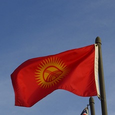 Kyrgyzstan flag. Image by Flickr user timbrauhn (CC BY-NC-SA 2.0).