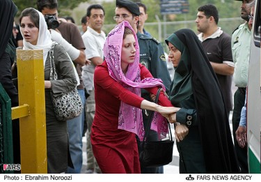 A photo from the semi-official Iranian news agency FARS of a woman being reprimanded for her attire.