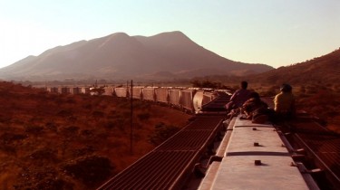 Cargo train carries migrants traveling accross Mexico to cross the border into the United States. Image by Pedro Ultreras from his film The Beast, used with his permission