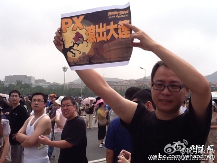 Sign reads: "PX—out of Dalian now!"
