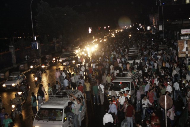 People in Kathmandu rush into the open space of New Road after an earthquake jolted the city. Image by Sunil Sharma, copyright Demotix (18/09/2011).