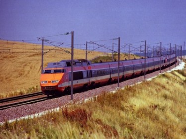 TGV train in the French countryside. Image by Flickr user Joost J. Bakker IJmuiden (CC BY 2.0).