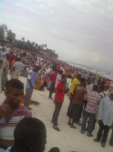 Friends, relatives and concerned citizens in Zanzibar standing in shock after MV Spice capsized. Photo courtesy of @Tanganyikan.