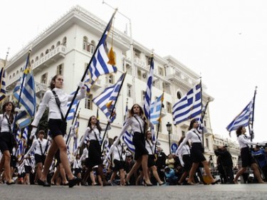 Students parade with Greek flags during Ochi Day, Thessaloniki, Greece. Image by Alexandros Michailidis, copyright Demotix (27/10/11). 