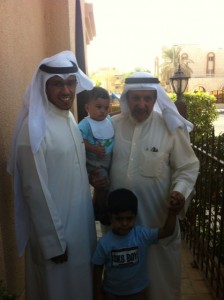 Hamad AlOlayan, left with his two children and father. Photo by Nusaiba Al Anjeri.