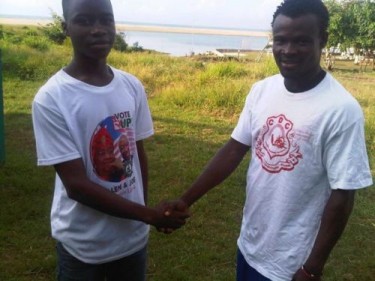 Reconciliation is the way forward: Two members of main politican parties in Liberia shaking hands. Photo courtesy of Photos of Liberia Elections 2011 Media Monitoring Group.