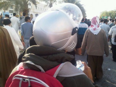 @anmarek: I asked this mourner why he is wearing a helmet! He said "protection!"