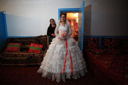 Rana Rajabova, a 24-year-old bride in the Azerbaijani village of Shirinbeili. Rana's grandparents, natives of the Arali village in Georgia's Adigeni region, were deported to Uzbekistan. Before the deportation they were told by the soldiers that they would return in 7 days, so no belongings should be taken. Her grandmother hid her gold jewelry at home with the hope of returning after a week. Rana's family has applied for the repatriation and says that they do not want to be "refugees." © Temo Bardzimashvili 