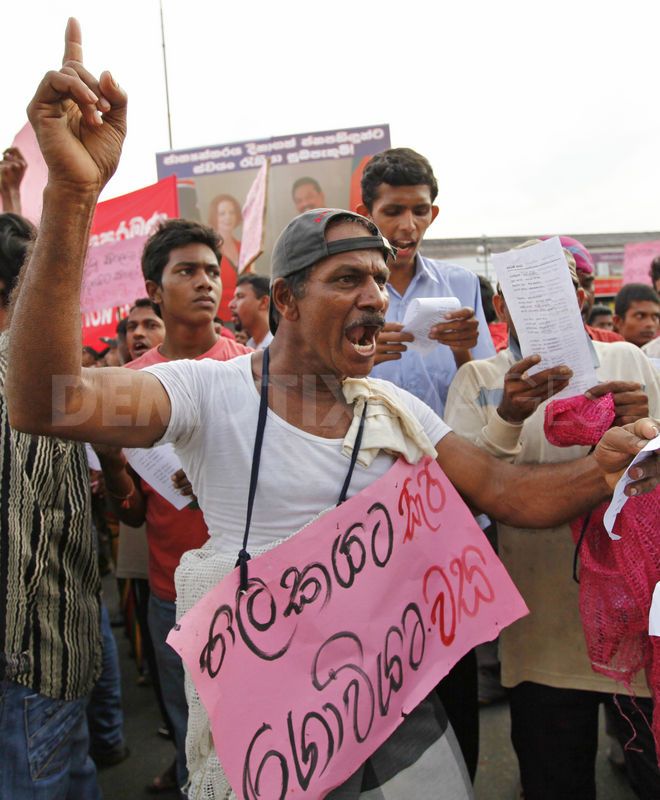 A man shouts during a protest over rising costs in living. Image by Rohan Karunarathne. Copyright Demotix (14/12/2011)