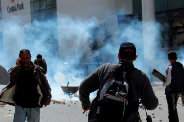Tear gas spreads through the air. Image by Flickr user Amine Ghrabi (CC BY-NC-SA 2.0).