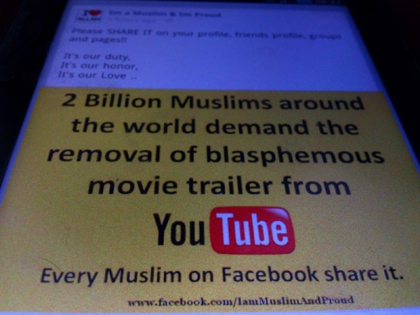 Facebook status of the largest Islamic faith community online on its demand to remove blasphemous movie about Mohammed at YouTube. Image by Sherbien Dacalanio. copyright Demotix