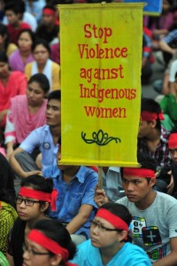 Indigenous students hold placards at a protest rally in Dhaka against the attack on the indigenous people in Rangamati. Image by Firoz Ahmed. Copyright Demotix (24/9/2012)
