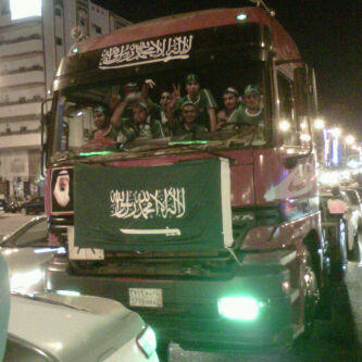 A bus full of young Saudi men celebrating National Day
