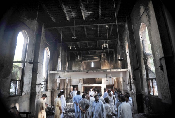 People gather at burnt Sarhadi Lutheran Church which was set ablaze by angry protesters during demonstrations against blasphemy anti-Islamic movie. Image by Owais Aslam Ali. Copyright Demotix (22/9/2012)