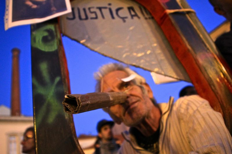 "A man wears a mock 'Pinocchio' nose as thousands gathered outside the Portuguese parliament to demonstrate against renewed austerity measures introduced by the Portuguese government." Photo by Violeta Moura copyright Demotix (15/10/2012)