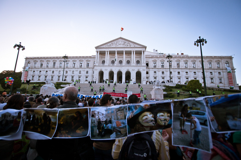 "Several thousand people gather in front of the Portuguese parliament to demand the resignation of the government following the announcement of a new budget." Photo by Xavier Malafosse copyright Demotix (15/10/2012)