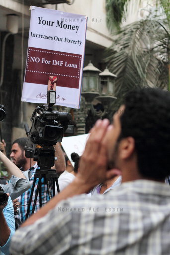 'Your money increases our poverty' banner raised by protesters against IMF loan during IMF delegation visit to Cairo. Photo by Mohamed Ali Eddin
