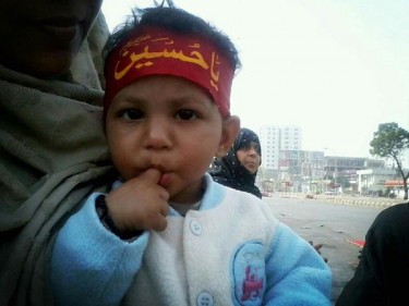 A child during a protest near Numaish Chowrangi.