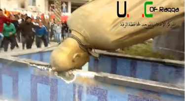 The destruction of Hafez Al Assad's statue in Al Rakka, Syria. Screen shot from YouTube video http://www.youtube.com/watch?v=6hFwEmgylJ4