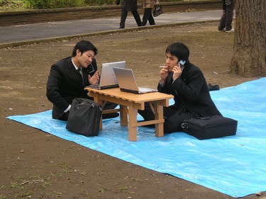 Japanese businessmen working in the park Photo by GaijinSeb (CC BY-NC-ND 2.0)