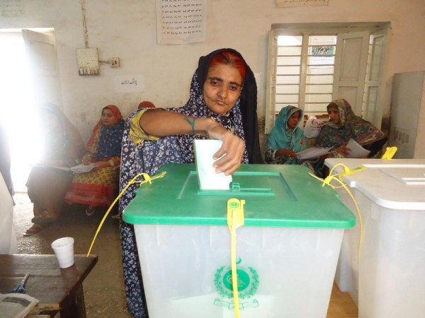 A woman is exercising her right to vote here during general elections 2013 at a polling station in the home town of Benazir Bhutto on Saturday. Image by jamal Dawood. Copyright Demotix (11/5/2013)
