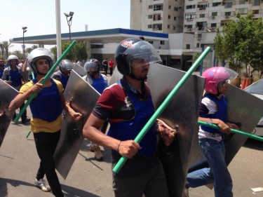 Morsi supporters carrying sticks and shields in Cairo today. Photograph shared by Kareem Fahim on Twitter.