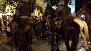 Policemen riding horses surround #j14 protesters near the Prime Minister's residence in Jerusalem Photo: #j14 activist Gali Fialkow