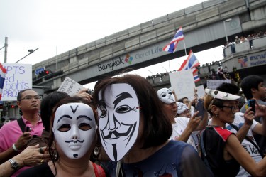 Protesters in Bangkok wearing a Guy Fawkes mask. Photo by Piti A Sahakorn, Copyright @Demotix (6/16/2013)