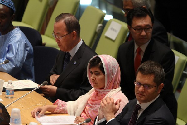 Malala Yousafzai, the Pakistan teen who survived an assassination attempt by the Taliban, at the United Nations on Friday. Beside her at left, is Ban Ki-moon, UN Secretary-General, and Mr. Vuk Jeremiae, President of the General Assembly. Image by Nancy Siesel. Copyright Demotix. (12 July 2013)