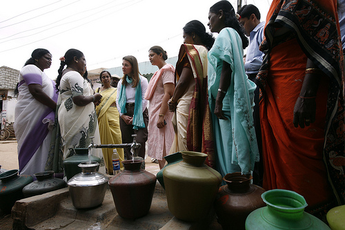 Melinda Gates speaks with women serving on the Bangalore Water Supply and Sewerage Board.  Image from Flickr by Gates Foundation. BY-NC-ND (Bangalore, India, 2005)