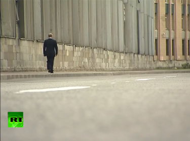 Putin walking down a desolate St. Petersburg street. YouTube screenshot.