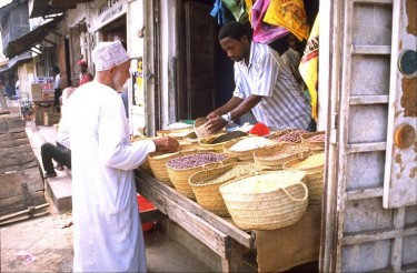 A market stall in Stone Town, Zanzibar, which is one of the most popular sites for tourists. Photo released under Creative Commons (CC BY-SA 3.0) by Wikipedia user Esculapio.