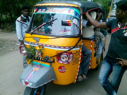 Cramming sixteen people in an autorickshaw. Image by Kiruba Shankar.