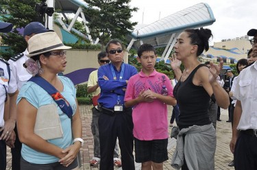 Ho Loy, a guest speaker for the Empty the Tanks protest argued with one of the organizer about the decision to remove the blood-tainted dolphin and some of the protesters.