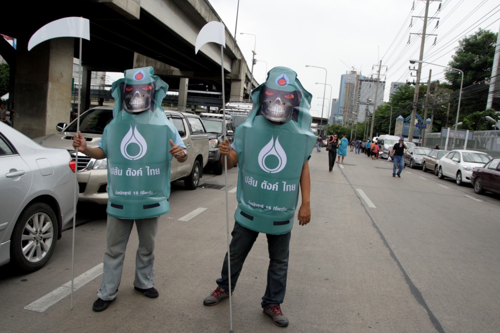 Protesters wearing LPG Gas dress during a rally. Photo by Piti A Sahakorn, Copyright @Demotix (9/23/2013)  